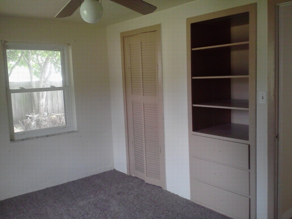 2nd bedroom built in shelves and drawers