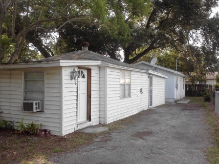 front view of home private drive, small front yard and back yard.  fences around all three sides